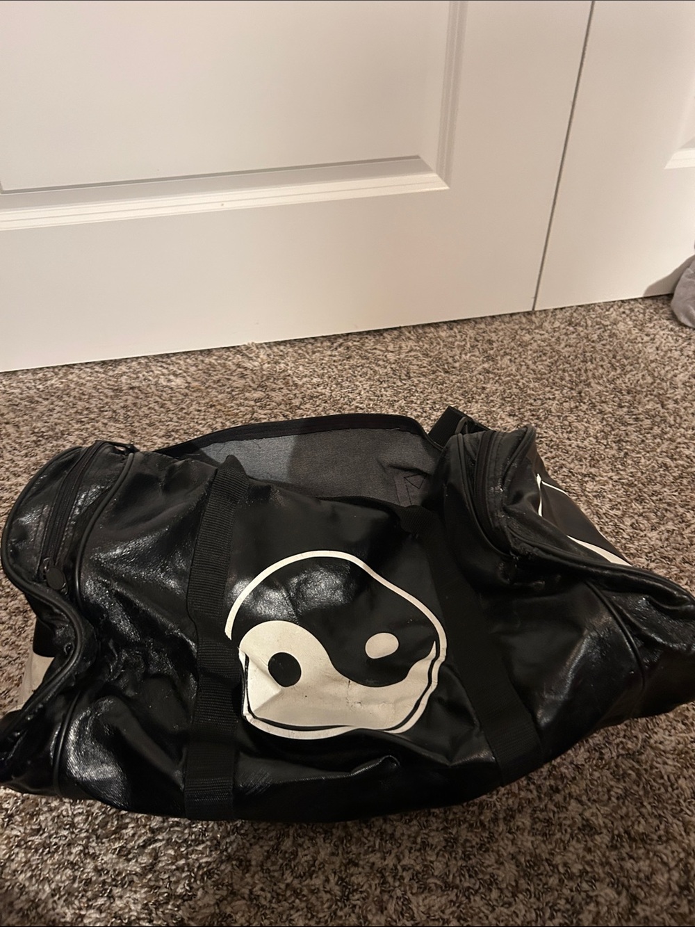 Black Vinyl Duffel Bag with Yin Yang and Pro Force shin guards